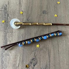 Beaded bobby pins are the perfect hair accessory! Moon bead hairpin and blue beaded hairpin both complemented with gold beads. Secured with nylon thread to a black bobby pin. These larger bobby pins make a unique gift or bridal accessory. Made with love for superior durability for everyday wear.  2 3/4 inches long. Gemstone Hairpins: https://www.etsy.com/shop/BriteComet?ref=seller-platform-mcnav§ion_id=24822473 Pearl Hairpins: https://www.etsy.com/shop/BriteComet?ref=seller-platform-mcnav§ion_id Beaded Bobby Pins, Clothes Clips, Beaded Hair Pins, Bobby Pin Hairstyles, Bridal Accessory, Pearl Hair Pins, Bobby Pin, Perfect Hair, Hair Accessory