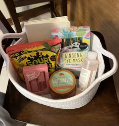 a basket filled with various items on top of a wooden table