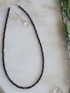 "Round faceted black spinel beaded sterling silver necklace. Looks great by itself or layered. Chain is sterling silver  15\" with 2.5\" chain extender to 17.5\" long" Black Beaded Sterling Silver Jewelry, Sterling Silver Jewelry With Round Black Beads, Adjustable Beaded Sterling Silver Crystal Necklace, Minimalist Black Jewelry With Faceted Beads, Sterling Silver Necklace With Faceted Round Beads, Black Rondelle Beaded Necklaces, Elegant Sterling Silver Necklace With Black Beads, Sterling Silver Rondelle Necklace With Faceted Beads, Black Single Strand Sterling Silver Jewelry