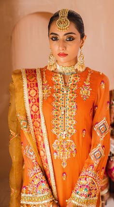 Traditional Dress Pakistani in Orange Shade is an outstanding and mind-blowing Pakistani Wedding Dress. This Pakistani Salwar Kameez is luxuriously crafted with vibrant yet mellow decorations on it making this ensemble a very stunning choice to style on the wedding parties of your loved ones. This dress can be stitched in two ways according to the demand of the customers. Kameez: This Traditional Dress Pakistani comes with a modish kameez in orange shade. This kameez comes in fine chiffon fabric Screen Printed Shirt, Dress Pakistani, Designer Brands Fashion, Asian Designers, Dress Name, Bridal Applique, Pakistani Wedding Dress, Pakistan Fashion, Screen Printing Shirts