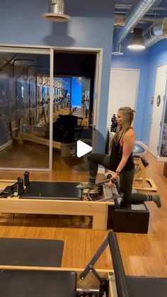 a woman is working out in the gym