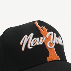 Gold Presidents New York Hat in Black, embroidered with orange and white stitching featuring the statue of liberty as the center piece. Classic trucker hat White thread embossing One size fits most Curved bill Adjustable snapback feature Shipping EXPRESS (3 - 5 days) UPS STANDARD (4 - 7 days) FREE (7 - 14 days) New York Hat, 10k Gold Chain, Picture Necklace, Mens Earrings Hoop, The Statue Of Liberty, Black Snapback, Gold Rope Chains, Gold Chains For Men, Nameplate Necklace