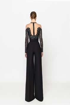 Elevate your style with the Naja Saade RTW23-09 black crepe jumpsuit. Featuring an intricately embroidered top and a removable belt, this jumpsuit exudes sophistication and elegance. Make a statement at any event with this timeless piece. Crepe Jumpsuit, Embroidered Top, Elevate Your Style, Black Diamond, Timeless Pieces, Moonstone, Your Style, Jumpsuit, 10 Things