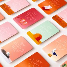 many different colored cards on a white surface