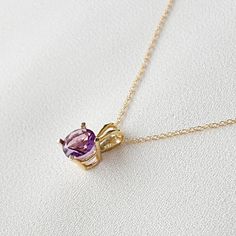 Indulge in elegance with our amethyst pendant necklace, a captivating piece that embodies sophistication and mystique. Crafted with precision, the exquisite amethyst gemstone, known for its enchanting purple hue, takes center stage, exuding an aura of tranquility and inner peace. Adorned with delicate detailing and suspended from a lustrous chain, this necklace adds a touch of glamour to any ensemble, making it the perfect accessory for both casual and formal occasions. Elevate your style with t Fine Jewelry Rose Gold Amethyst Necklaces, Fine Jewelry Rose Gold Amethyst Necklace, Elegant Purple Pendant Birthstone Necklace, Elegant Purple Necklace With Prong Setting, Elegant Gold Amethyst Birthstone Necklace, Elegant Amethyst Birthstone Necklace, Formal Amethyst Round Pendant Necklace, Formal Amethyst Birthstone Necklace, Purple Oval Pendant Necklace For Anniversary