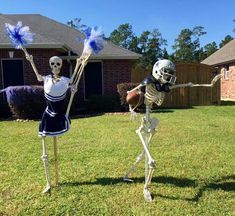 two skeletons dressed up in cheerleader gear, one is throwing a football to the other