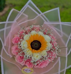 a bouquet of flowers on top of a table