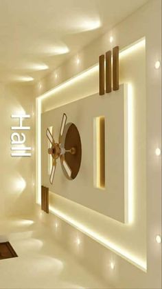 a clock mounted to the side of a wall in a room with lights on it