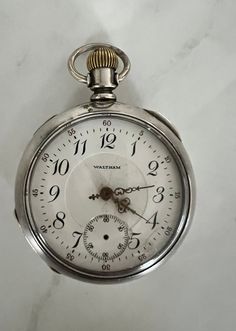 Vintage American Waltham Watch Co. open face pocket watch. 1905, 17j, size 18, run quantity: 4500, grade/model total production: 322850, serial # 14368316 Very good condition, winds and runs. Missing second hand.  See photos for measurements. Waltham Watch, Old Pocket Watches, Clock Repair, Timeless Watches, Vintage Clocks, Pocket Watch Antique, New Smyrna Beach, Open Face, The Cult