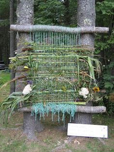 a sculpture made out of branches and plants