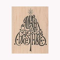 a rubber stamp with the words merry christmas on it