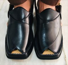 *This indigenous leather chappal craft from Pakistan showcases the skills of South Asian artisans and utilizes the finest quality leather. This jet-black leather Peshawari chappal not only elevates your style but also becomes a statement piece, enhancing your presence in any setting. Crafted with an additional sole for added comfort, our skilled artisans ensure precision and finesse in every stitch. *These exquisite handcrafted Peshawari Chappals are often referred to as Kaptaan Chappals or Imra Traditional Black Slip-on Huarache Sandals, Leather Sandals With Dabka And Round Toe, Traditional Black Sandals With Single Toe Strap, Black Closed Toe Sandals For Festivals, Traditional Black Open Toe Huarache Sandals, Traditional Black Closed Toe Sandals, Genuine Leather Sandals, Trendy Sandals, Sandals Casual