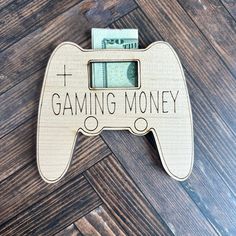 a video game controller with the words gaming money on it