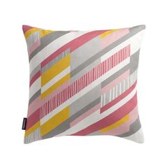 a pink, yellow and grey pillow on a white background