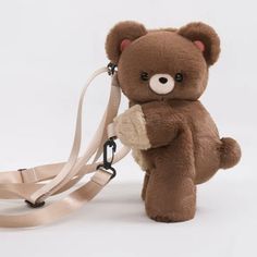 a brown teddy bear with a leash attached to it's back, on a white background