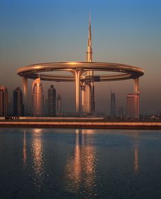 a large body of water with buildings in the background