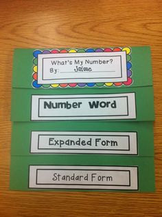 two green and white cards with numbers on them, one is for the number word expanded form