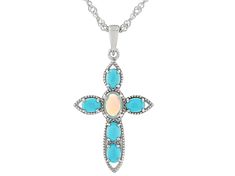 0.30ctw Oval Cabochon Ethiopian Opal With 4x3mm Oval Cabochon Sleeping Beauty Turquoise Rhodium Over Sterling Silver Cross Pendant With 18"Singapore Chain. Measures Approximately 1.25"L x 0.74"W. 3.5mm bail. Lobster clasp with 2"extender. Oval White Gold Jewelry With Gemstone Accents, Sterling Silver Jewelry With Oval Cabochon Accent Stones, Sterling Silver Jewelry With Gemstone Accents Oval Cabochon, Sterling Silver Jewelry With Oval Cabochon Gemstone Accents, Silver Jewelry With Oval Cabochon Gemstone Accents, Silver Oval Multi-stone Jewelry, Silver Ethiopian Opal Pendant Necklace, Sterling Silver Multi-stone Jewelry With Oval Cabochon, Elegant Ethiopian Opal Cabochon Jewelry