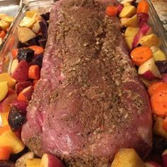 a close up of meat and vegetables in a dish