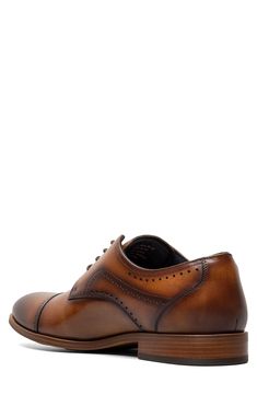 Burnished leather and traditional broguing enhance the silhouette of this cap-toe shoe built with anatomic support and a flexible sole. Flexzone removable, cushioned insole with arch support Leather upper/synthetic lining/rubber sole Imported Leather Footbed Cap Toe Oxfords, Brown Derby Shoes With Branded Insole And Cap Toe, Brown Cap Toe Oxfords With Perforated Toe Box, Fitted Plain Toe Oxfords With Leather Footbed, Fitted Leather Footbed Oxfords With Plain Toe, Cap Toe Derby With Leather Footbed, Fitted Dress Shoes With Leather Footbed For Derby, Derby Oxfords With Perforated Plain Toe, Fitted Cap Toe Leather Shoes With Goodyear Welt