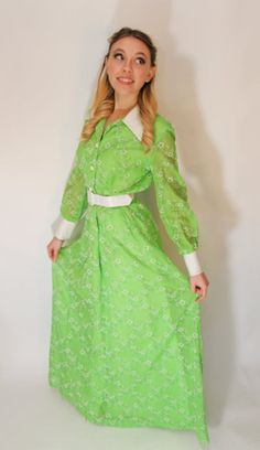 "Bright and cheery, this 1970s maxi dress is clean, detailed and distinct. The contrast of the bright green with stark white accents on collar, belt, cuffs and buttons makes this cute as can be. Long cuffed sleeves and a shirt waist, bobble buttons down the front with additional snap and hook closures. Belt is shiny white leather. The fabric content is 65% polyester and 35% cotton on the outer layer - It's kind of like a gauze cloth with felted raised flowers. The lining is 100% acetate, and all 1970s Green Long Sleeve Dress, 1970s Style Green Long Sleeve Dress, Vintage Green Spring Maxi Dress, Vintage Green Maxi Dress For Spring, Spring Vintage Green Maxi Dress, Retro Green Long Sleeve Maxi Dress, Green Long Sleeve Retro Maxi Dress, Vintage Green Collared Dress, Retro Spring Maxi Dress For Daywear