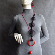 Long necklace, Bib necklace, Mesh necklace, Black and red contemporary necklace, statement necklace, Unusual necklace, Black red jewelry set. Beautiful mesh contemporary long black and red adjustable size open necklace. Unusual and stylish beaded statement necklace or jewelry set. Bohemian style velvety jewelry for lovers of unusual and unique handmade crafts.  In options you can choose: - Product or jewelry set.  Jewelry sets are with calculated discount price. - Necklace length about 39.4"/100cm - Earrings length: 3"/ 7,5cm Please contact me for any additional information you need. I'm here for you. Thank you for visiting my shop. Have a nice day :) Elegant Handmade Red Long Necklace, Modern Red Necklace For Party, Handmade Red Necklace For Evening, Red Jewelry Set, Open Necklace, Unusual Necklace, Mesh Necklace, Contemporary Necklace, Set Jewelry