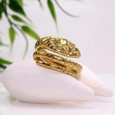 Gold snake ring.This unique serpent ring is hand sculptured in wax and cast with lost wax casting technique.We will prepare it in the size you chose from the drop down list but it can be adjusted for comfortable fit.The weight of this ring is 9gr.Top width: 14mmThis ring is available in• Plain 925 sterling silver • 22K gold vermeil (durable gold plating over 925 sterling silver - for further details see FAQ section)Select the option of your choice from the drop down list.•  Choose your ring size Unique Hand Cast Snake Ring As Gift, Unique Hand Cast Snake Ring Gift, Unique Handmade Snake Ring, Unique Snake-shaped Rings As Gifts, Unique Handmade Snake-shaped Ring, Handmade Snake Shaped Ring As Gift, Snake Ring Gold, Serpent Ring, Fish Jewelry