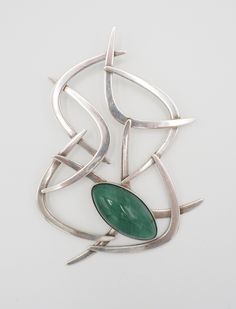 "Listing is for massive OOAK Art Studio Biomorphic sterling silver jade abstract pendant Absolutely stunning, unique pendant with nature inspired asymmetrical cut out design and beautiful green jade center stone. Pendant measures 5\" top to bottom (12.7 cm) , 3.4\" across ( 8.7 cm) Stone is 1.7\" x 0.8\" x 0.5\". Weight is 58.5 grams. Pendant is not signed. Wearable art piece!" Abstract Pendant, Artisan Jewelry Necklaces, Metal Smithing, Asymmetrical Cut, Handcrafted Artisan Jewelry, Cut Out Design, Unique Pendant, Lovely Earrings, Green Jade