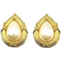 A Pearl Teardrop Kiss Earring. A striking gallery, ribbed and with criss-crossing, reminds us of kisses! Crafted in gold plated metal with a central large glass faux pearl. Wonderful quality. Very good vintage condition, 4cms. A stunning pair of earrings that sing 80s glamour. Established in 2016, this is a British brand that is already making a name for itself in the jewellery world both at home and internationally. The founder has a deep love for timeless and unique jewellery. Curating rare an Vintage Dior Earrings, 80s Glamour, Jennifer Gibson, Cheshire England, Dior Earrings, Deep Love, Vintage Jewellery, Vintage Dior, Vintage Earrings