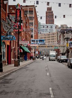 a city street with cars parked on both sides