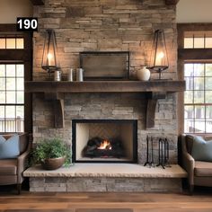 a living room with a fire place and two couches in front of the fireplace