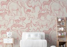 a bedroom with pink wallpaper and an animal pattern on the wall, along with a white bed