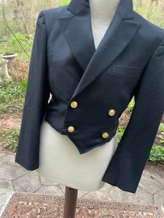 This neat as a pin double-breasted military coat has 4 brass military buttons, one inside pocket and one exterior breast pocket.  Fully lined.  The label tells us it's a size 33short., but pay attention to the measurements. Shoulder to shoulder 16" Chest 33" Sleeves 15" under arm; 23' along the top Length 18" Military Coat, Wool Dress, Wool Coat, Inside Pocket, Double Breasted, Jackets & Coats, Gender Neutral, Bathing Beauties, Adult Outfits