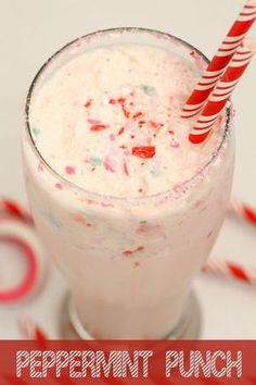 peppermint punch in a tall glass with candy canes on the rim and text overlay that reads peppermint punch