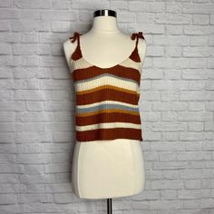 Item: Knit Tank Top Size: Small Brand: Boutique Features: Functional Shoulder Ties, Striped Pattern, Scoop Neckline Colour(S): Brown, Cream, Golden Mustard, Blue/Grey Material: 100% Acrylic Shipping: $4.99 Condition: New Without Tags. No Holes, Stains Or Tears Measurements: - Length: 20” - Bust: 30”- 40” - Waist: 32”- 46” Striped Ribbed Sleeveless Top, Multicolor Knit Sleeveless Tank Top, Casual Yarn-dyed Striped Tops, Spaghetti Strap Blouses, Striped Stretch V-neck Top, White Silk Blouse, Linen Tank, Knit Tank Top, Knit Tank