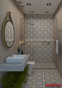 a bathroom with blue and white tiles on the walls