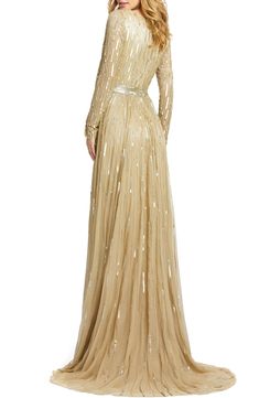 Look like you just stepped off the red carpet in this plunging V-neck gown illuminated with stripes of glittering sequins and light-catching beads. Style Name:Mac Duggal Long Sleeve Sequin & Bead Stripe Gown. Style Number: 5903330_1. Luxury V-neck Gown With Sequins, Luxury Sequined V-neck Gown, Luxury V-neck Sequined Gown, Glamorous Embellished Gown For Red Carpet, Red Carpet Embellished Floor-length Gown, Floor-length Embellished Gown For Red Carpet, Formal Cocktail Attire, Wedding Questions, Macys Women