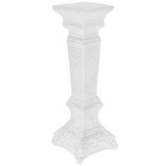 a tall white vase sitting on top of a table