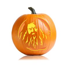 a carved pumpkin with the face of bob marley on it