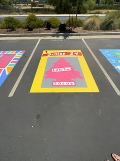 someone is standing in the parking lot with their feet on the ground and painted squares