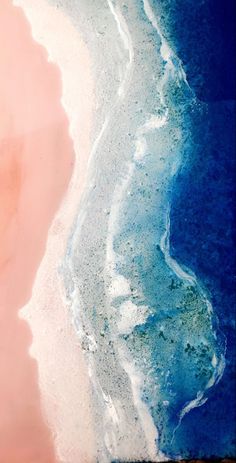 an aerial view of the ocean and beach