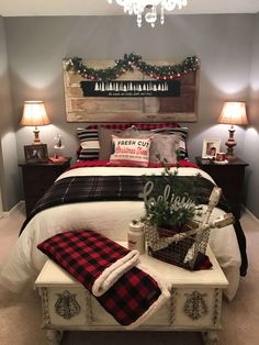 a bedroom decorated for christmas with red and black decor