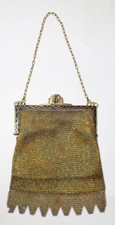 an old purse is hanging from a chain