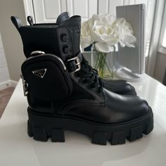 Elevate Your Style With These Stunning Prada Monolith Boots! Made From High-Quality Leather, These Ankle Boots Feature A Combat Style And Are Perfect For Any Fashionable Woman. The Black Color Adds A Touch Of Sophistication To Any Outfit, While The Uk Shoe Size Of 7.5 And The Us Shoe Size Of 9.5 Ensure A Comfortable Fit.The Prada Monolith Boots Are Tailored To The Modern Woman And Have A Model That Complements Any Wardrobe. With Its Stylish Design, These Boots Are Perfect For Any Occasion, Whether It's A Night Out With Friends Or A Day At The Office. Buy Now And Add A Chic Touch To Your Shoe Collection! Worn Only 4-5 Times Max Excellent Like New Condition, No Scratches, No Dents No Dings. Prada Boots Women, Prada Boots Outfit, Prada Monolith Boots, Prada Monolith, Prada Boots, Combat Style, Patent Boots, Shoes Prada, Prada Shoes