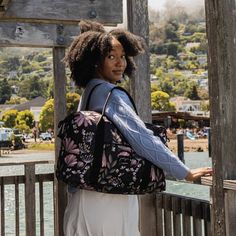 Whether you're headed away for a long weekend or stopping by the gym– the Lola Duffel is made to go where you go. The Lola was designed with features like the luggage sleeve that slides over your suitcase handle, plenty of organization with zippers and mesh pockets, and an exterior pocket for a quick access point. Casual Black Weekender Bag For Weekend Trips, Casual Black Travel Bag For The Weekend, Casual Black Travel Bag For Weekend, Casual Black Luggage, Casual Large Capacity Duffle Bag For Weekend, Black Weekend Travel Bag, Casual Tote Gym Bag For Weekend, Gym Tote Bag, Suitcase Handle