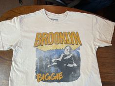 a white t - shirt with the words brooklyn biggie on it