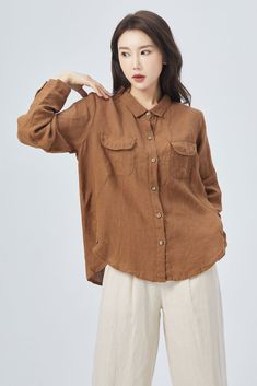 "Introducing our stunning brown linen long-sleeve shirt, crafted from high-quality, breathable linen fabric. The versatile brown color is a timeless classic, pairing well with any outfit. The relaxed fit makes it comfortable and easy to wear, whether dressed up or down. Perfect for any season, this shirt is sure to become a staple in your wardrobe. Details: * 100% linen * Casual Linen shirt, Plus size Linen shirt * long sleeves Linen shirt * Plus size Linen top * Oversize Linen blouse * Fashiona Cheap Brown Cotton Blouse, Brown Long Sleeve Solid Color Blouse, Brown Long Sleeve Solid Blouse, Brown Solid Color Tops For Work, Brown Long Sleeve Shirt With Pockets, Spring Brown Solid Color Blouse, Brown Solid Color Blouse For Fall, Brown Long Sleeve Tops With Pockets, Brown Long Sleeve Shirt With Buttons