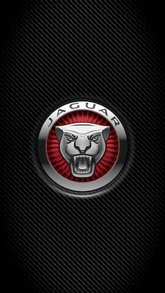 the jaguar logo on a black background with red and silver accents is seen in this image