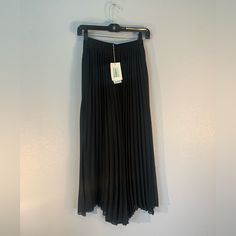 New With Tag Never Worn Minimalist & Classy & Elegant Black Maxi Pleated Skirt Perfect For Day-To-Day Work & Casual Outings & Fancy Cocktail Events This Classic Skirt Will Complete Your Quiet Luxury Look & Stylish Fit Spring Black Pleated Skirt Bottoms, Casual Black Pleated Skirt With Elastic Waistband, Black Pleated Full-length Bottoms, Black Pleated Full-length Skirt, Black Full-length Flowing Pleated Skirt, Black Full Length Flowy Pleated Skirt, Full Length Black Pleated Skirt, Full Length Black Flowy Pleated Skirt, Full Length Flowy Black Pleated Skirt