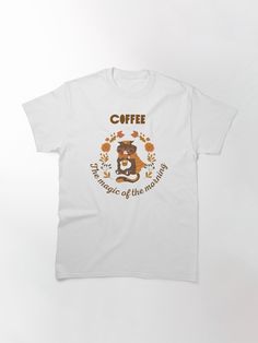 a white t - shirt with the words coffee and a teddy bear on it's chest